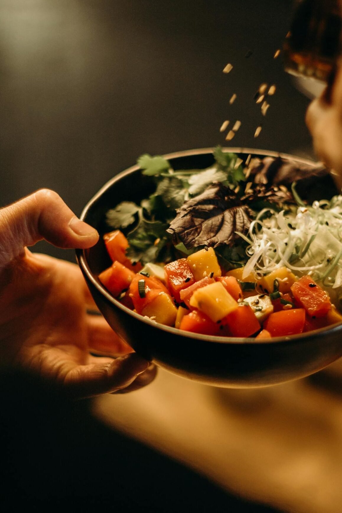 A delicious bowl of Asian salad with fresh vegetables and sesame seeds, perfect for a healthy meal.
